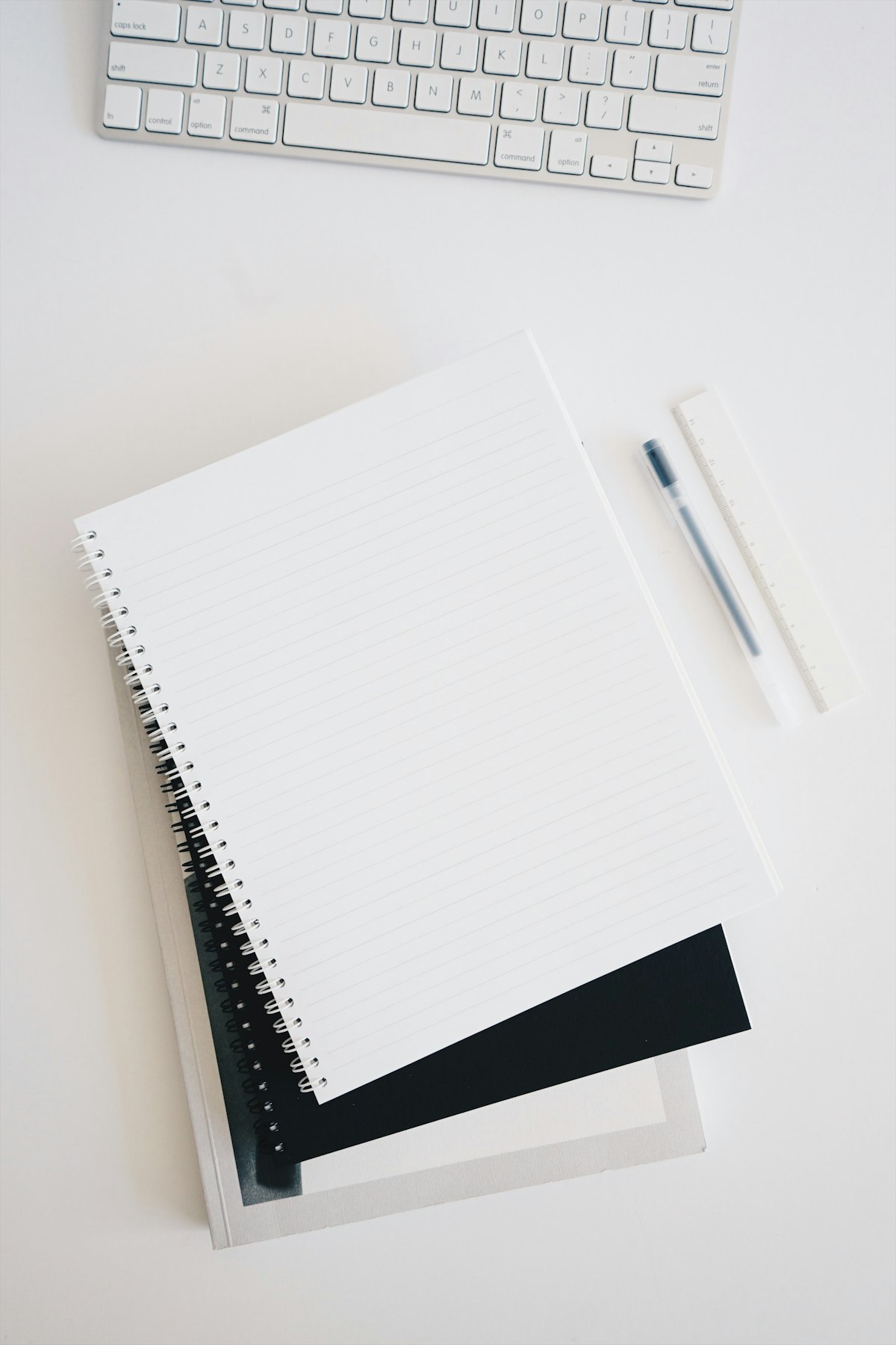 Writing desk with pens and notebooks